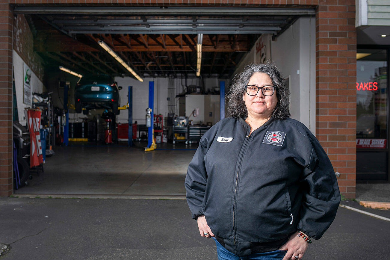 Emiliana Chávez stands in front of her flagship garage at the intersection of Evergreen and Casino on Thursday, Feb. 17, 2022, in Everett, Washington. (Ryan Berry / The Herald)