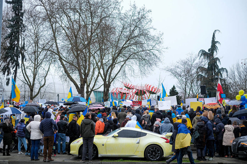 Hundreds gathered in front of the Space Needle in Seattle on Saturday to rally against the Russian war in Ukraine. The crowd sang the Ukrainian national anthem, followed by “The Star-Spangled Banner.”(Taylor Goebel / The Herald)
