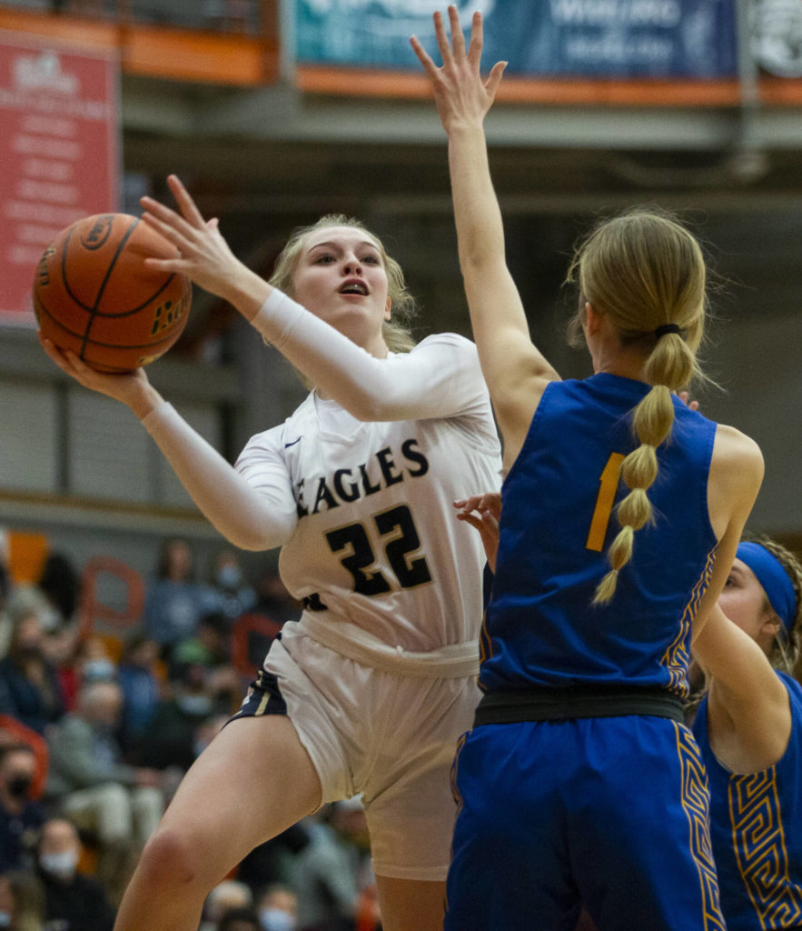Arlington’s Kierra Reese attempts a layup during the game against Kelso on Friday, Feb. 25, 2022 in Everett, Washington. (Olivia Vanni / The Herald)
