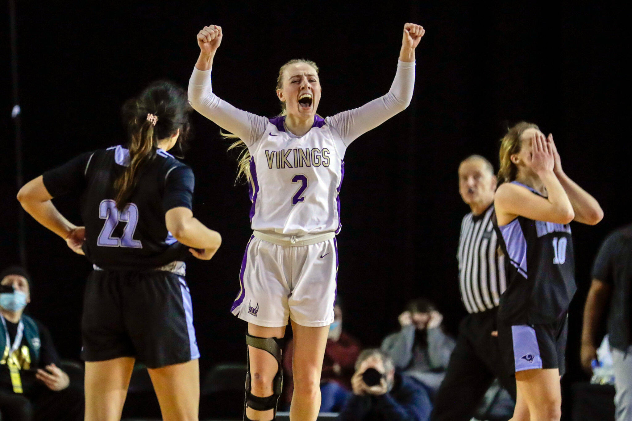 Lake Stevens’ Chloe Pattison celebrates her team’s victory over Rogers on Wednesday afternoon in Tacoma. The Vikings advance with the 41-37 overtime win over the Rams. (Kevin Clark / The Herald)