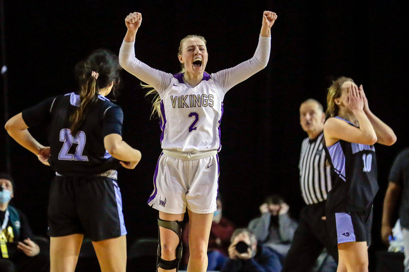 Lake Stevens' Chloe Pattison celebrates their victory over Rogers Wednesday afternoon in Tacoma, Washington on March 2, 2022. The Vikings advance with the 41-37 overtime win over the Rams. (Kevin Clark / The Herald)