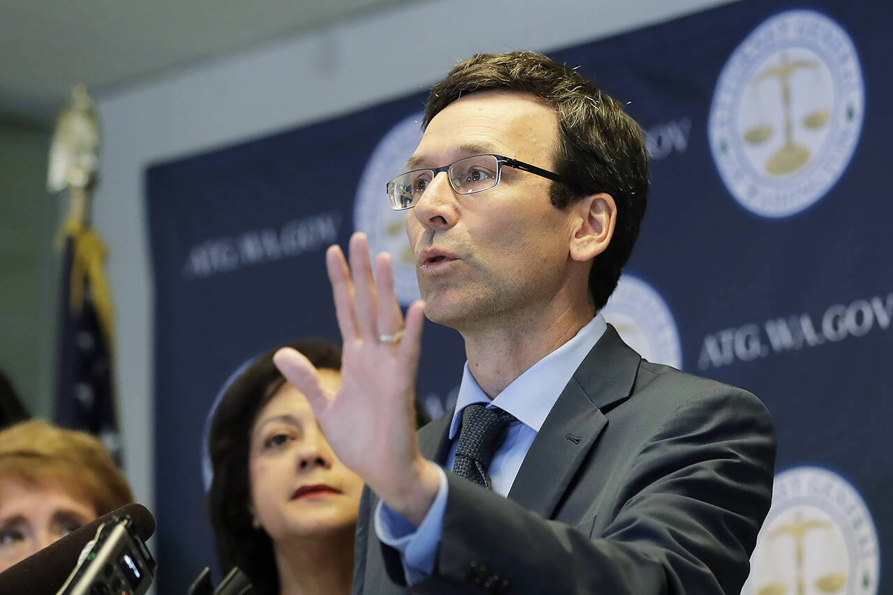 A trade group that represents some of the biggest U.S. food companies has agreed to pay $9 million for violations of Washington campaign finance laws, after the state Supreme Court upheld a penalty twice that much. Washington Attorney General Bob Ferguson, shown here, announced the AG’s office was dropping its appeal and would settle the case. (AP Photo/Ted S. Warren, File)