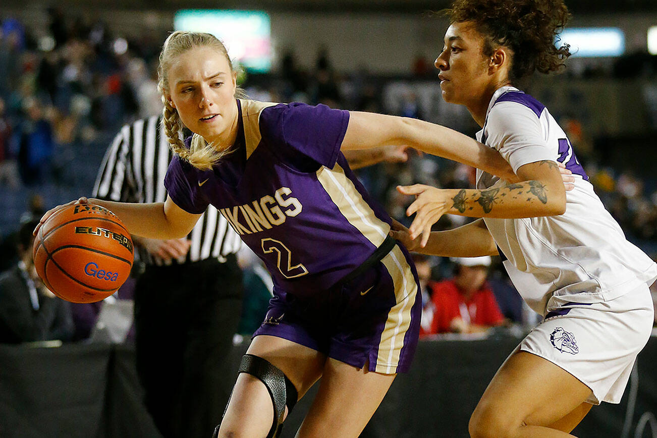 Lake Stevens’ Chloe Pattison dribbles to the baseline against Pasco Thursday, March 3, 2022, during a 4A matchup at the Tacoma Dome in Tacoma, Washington. (Ryan Berry / The Herald)