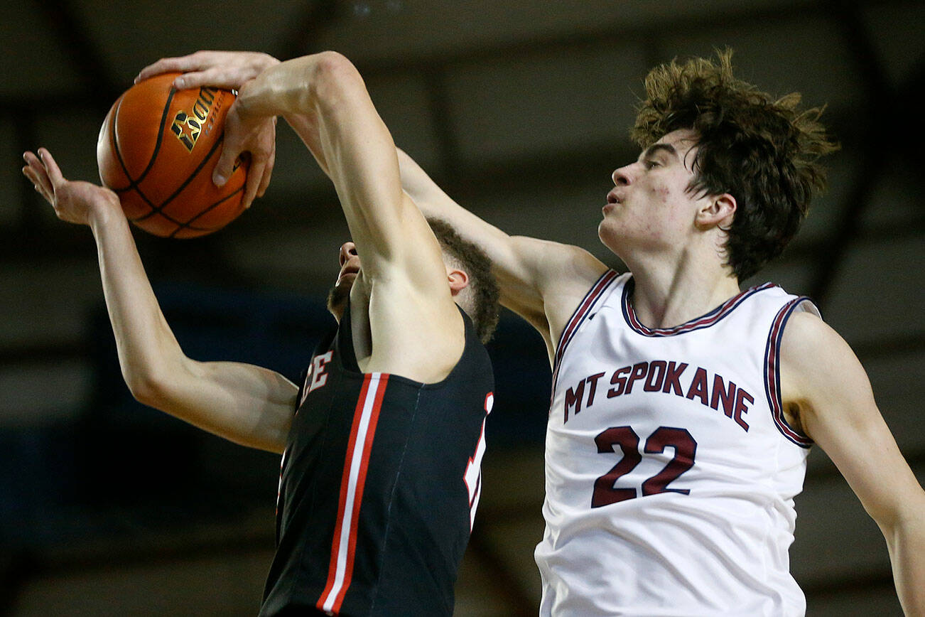 Mountlake Terrace’s Chris Meegan gets blocked by Mt. Spokane’s Andrew Rayment Thursday, March 3, 2022, during a 3A matchup at the Tacoma Dome in Tacoma, Washington. (Ryan Berry / The Herald)