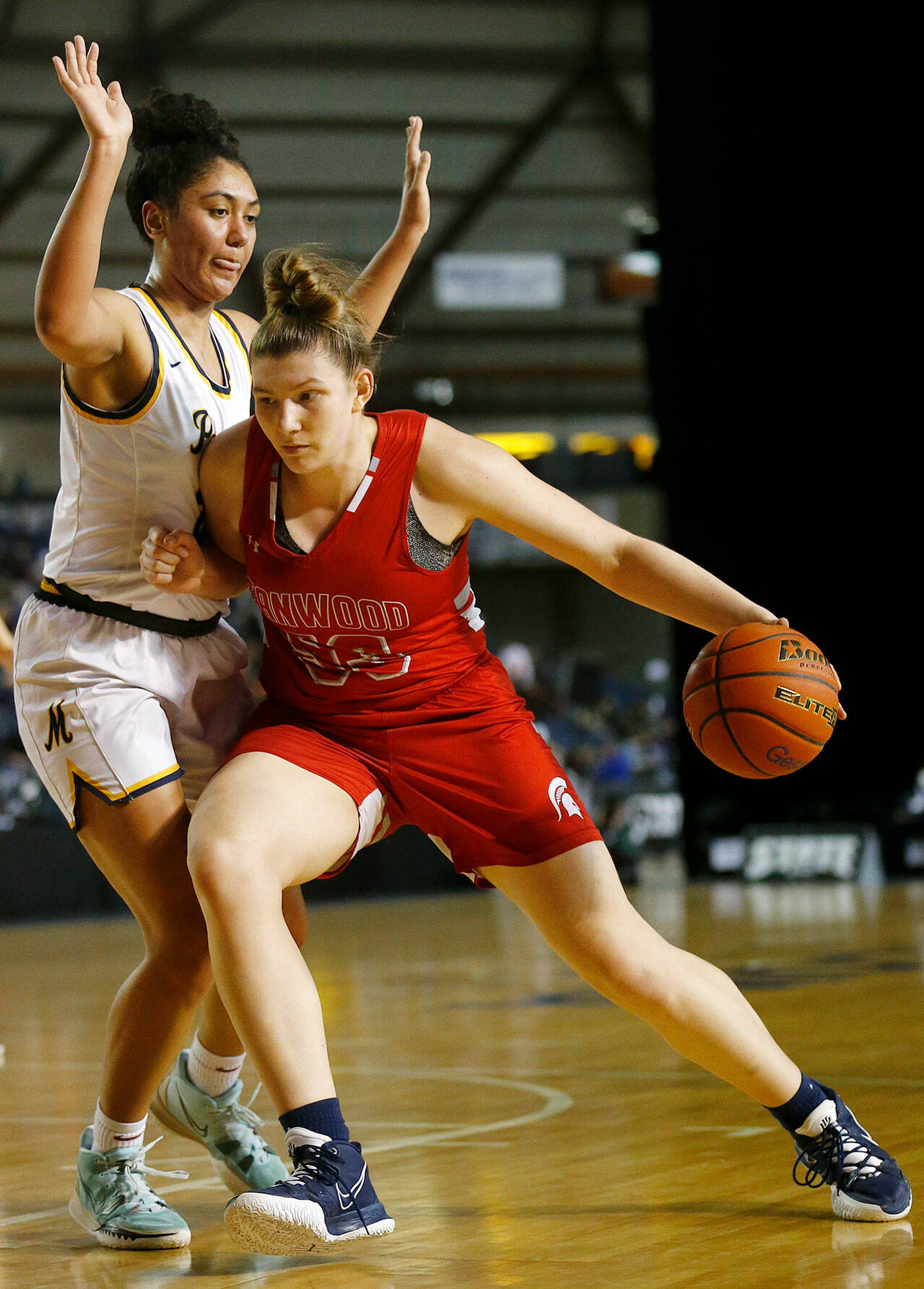 Stanwood’s Vivienne Berrett backs down a Mead defender during a 3A state quarterfinal game Thursday in Tacoma. (Ryan Berry / The Herald)