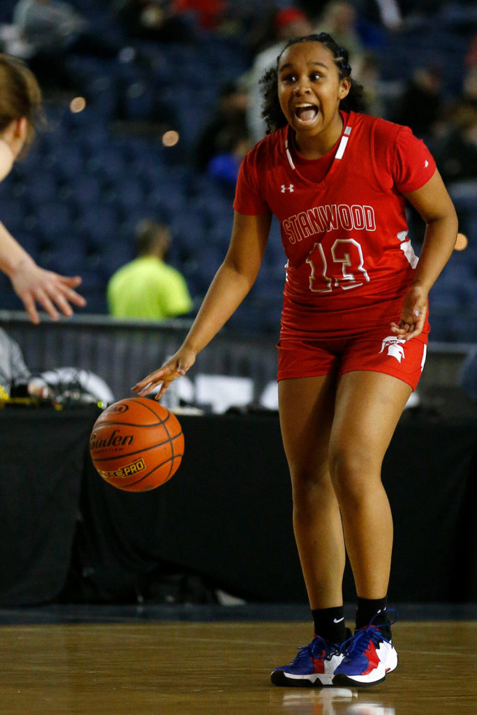 Stanwood’s La’Tana Swinton calls out to her teammates while setting up a play against Mead on Thursday at the Tacoma Dome. (Ryan Berry / The Herald)
