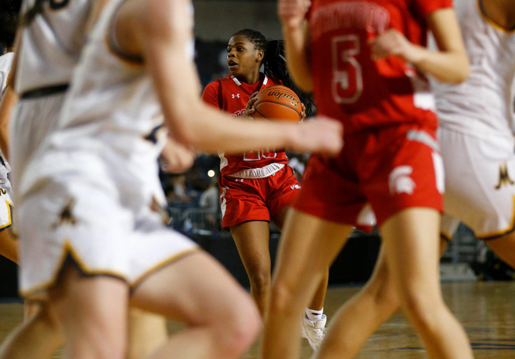 Stanwood’s Chloe Santeford looks to pass the ball against Mead on Thursday at the Tacoma Dome. (Ryan Berry / The Herald)

