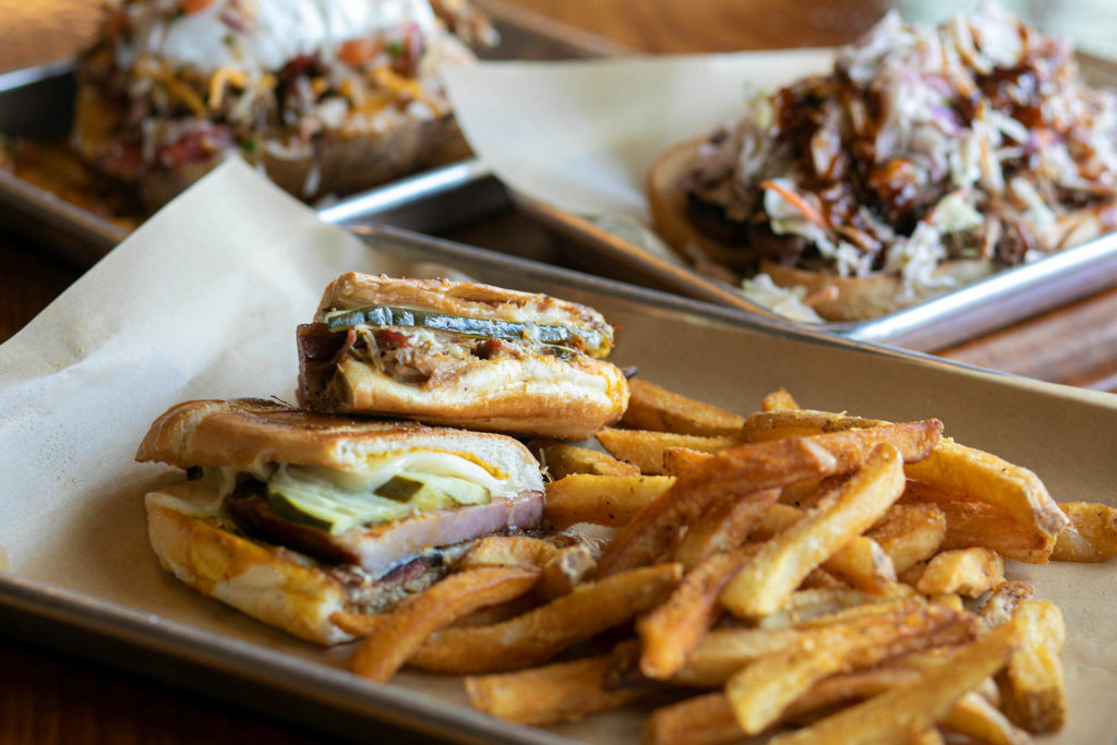 The Barbecue Cubano sandwich is prepared alongside other entrees at Meatheads. (Ryan Berry / The Herald)
