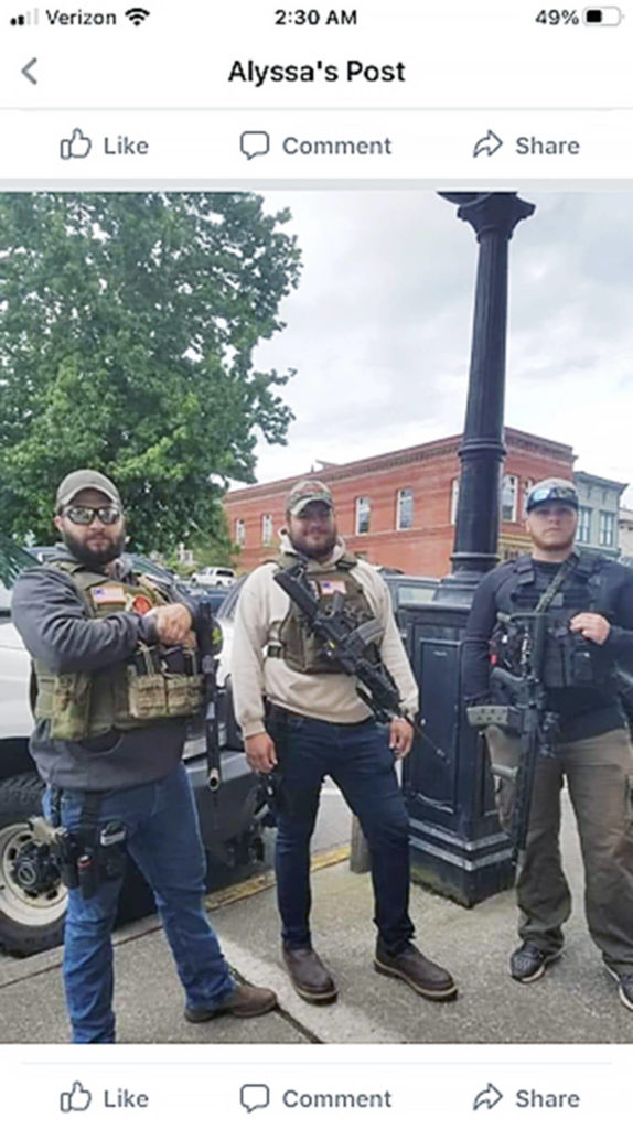 Calvin Walker (center) during the May 31, 2020, vigilante gathering in Snohomish, from a social media post questioning his hiring the next year as a deputy sheriff. (Snohomish County Sheriff’s Office)
