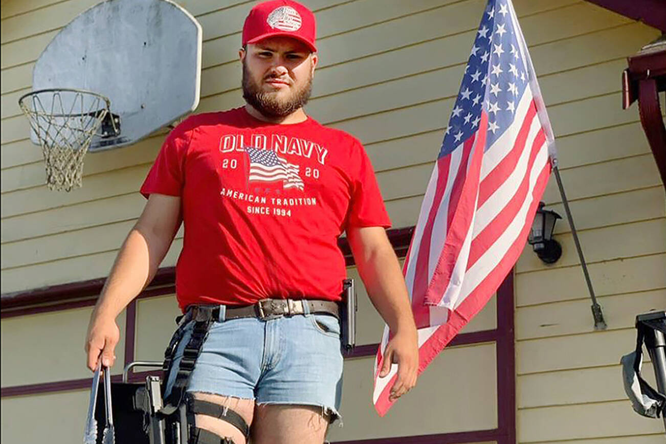 The Snohomish County Sheriff’s Office launched an investigation into the background of Calvin Walker, a new hire, after a sergeant expressed concerns about a comment on a photo posted to Walker’s Facebook page in August 2020. A friend asked whether the image, showing Walker in cowboy boots and an American flag t-shirt, was “racist or misogynistic.” Walker responded, “it’s honestly a lot of both.” Walker was fired from the Sheriff’s Office in January 2022 as a result of the investigation. (Snohomish County Sheriff's Office)