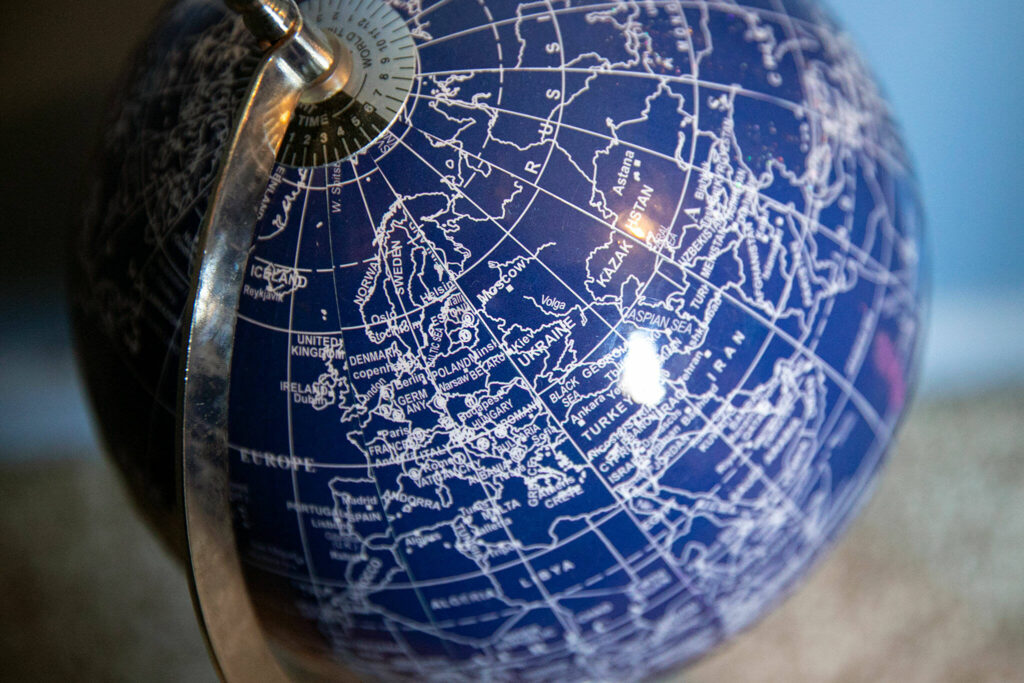 A globe sits on the floor in Mykyta’s bedroom Sunday in Snohomish. (Ryan Berry / The Herald)
