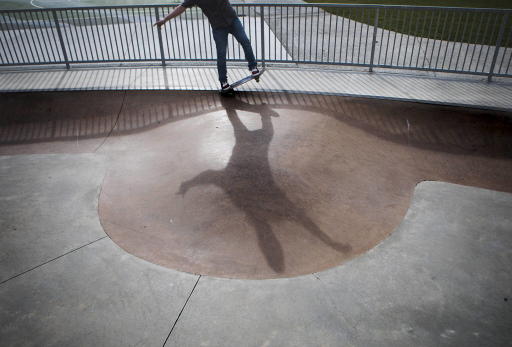 Hunter Lundeen works on a backside 5-0 trick on his skateboard at Cavalero Hill Skate Park on March 1 in Lake Stevens. (Olivia Vanni / The Herald)
