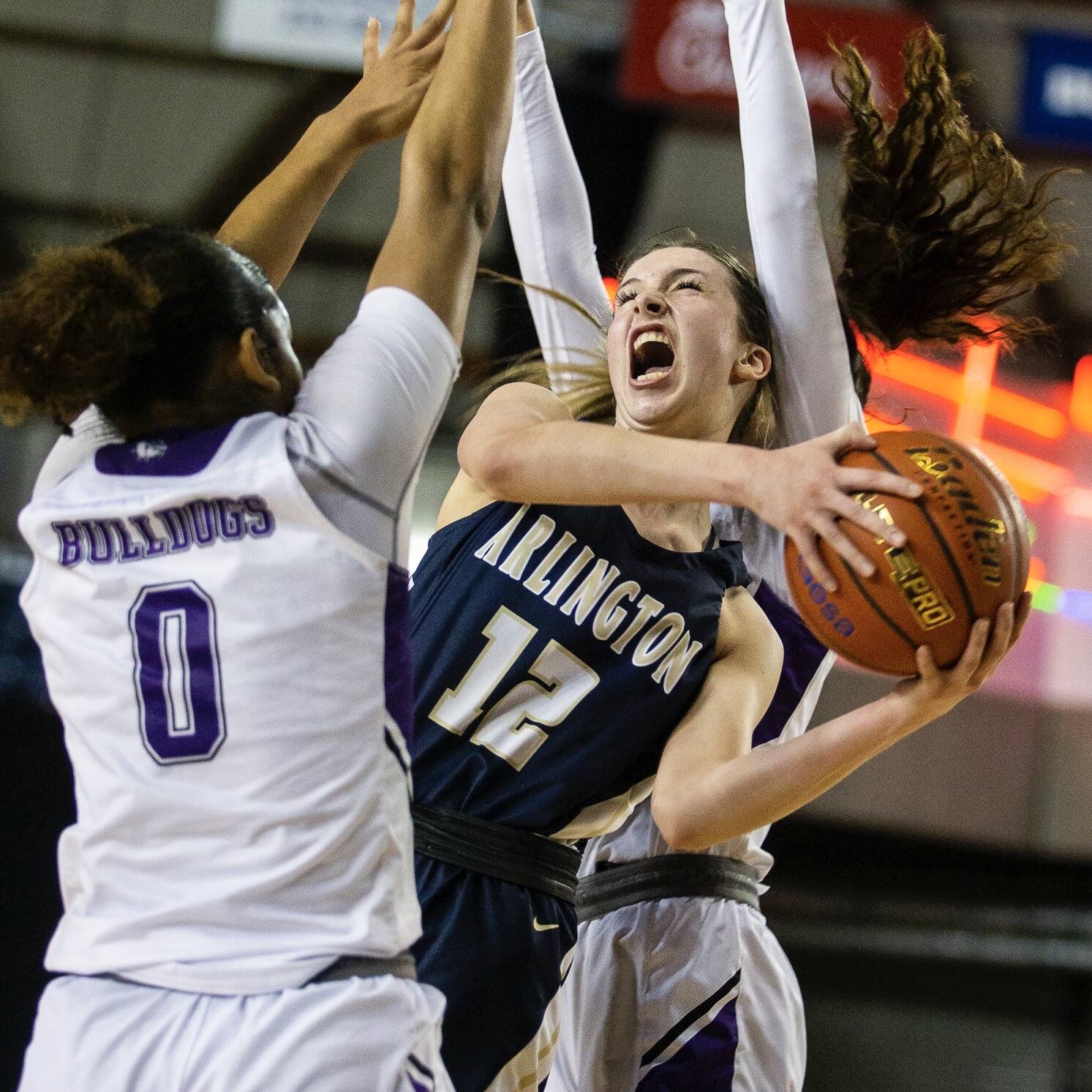 Arlington senior Hannah Rork draws a foul while attacking the basket. (Olivia Vanni / The Herald)