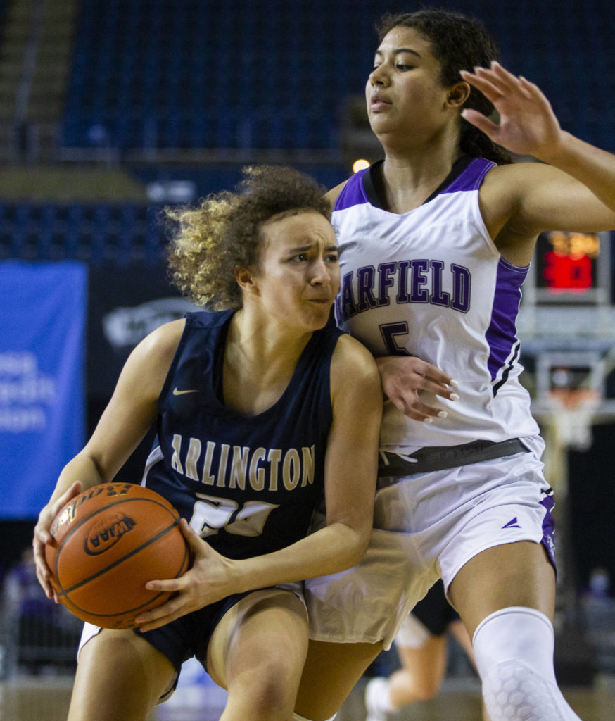 Arlington’s Samara Morrow drives to the hoop during the 3A state semifinal against Garfield at the Tacoma Dome on Friday, March 4, 2022. (Olivia Vanni / The Herald)
