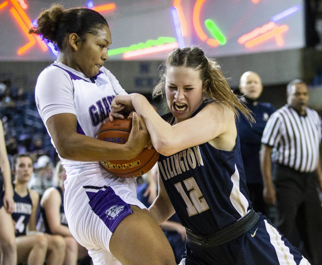 Hannah Rork (right) and Arlington went toe to toe with the unbeaten defending state champions, but Garfield surged ahead in the fourth quarter and pulled away to hand the Eagles a 56-42 loss Friday night in a Class 3A state semifinal in the Tacoma Dome. (Olivia Vanni / The Herald)
