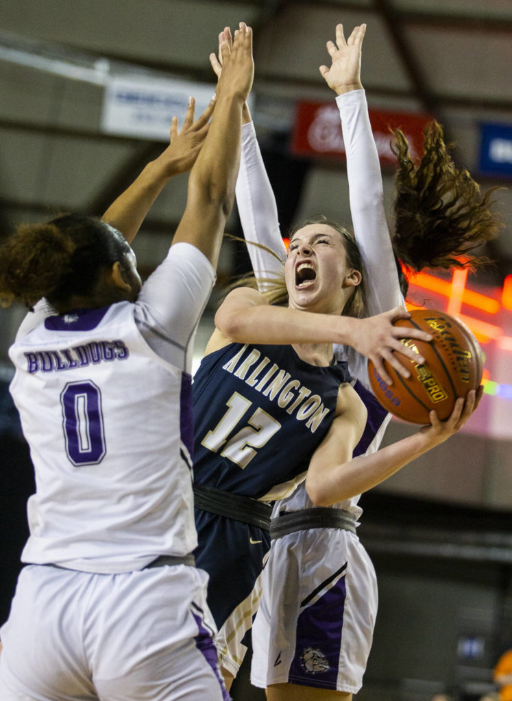 Arlington senior Hannah Rork draws a foul while attacking the basket. (Olivia Vanni / The Herald)
