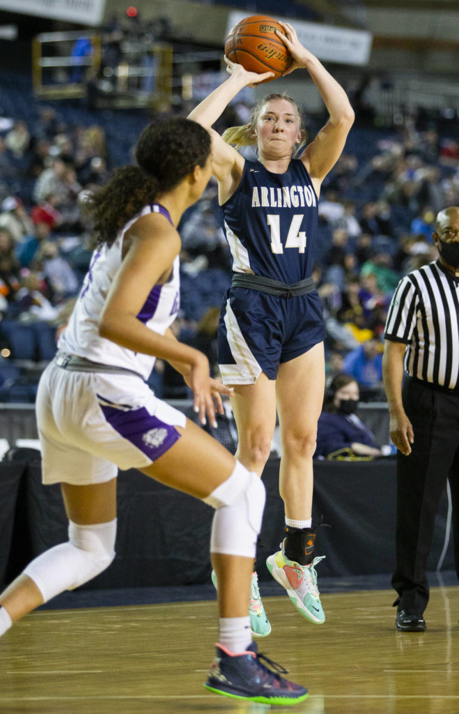 Arlington’s Keira Marsh takes a three-point shot during the 3A state semifinal against Garfield at the Tacoma Dome on Friday, March 4, 2022. (Olivia Vanni / The Herald)
