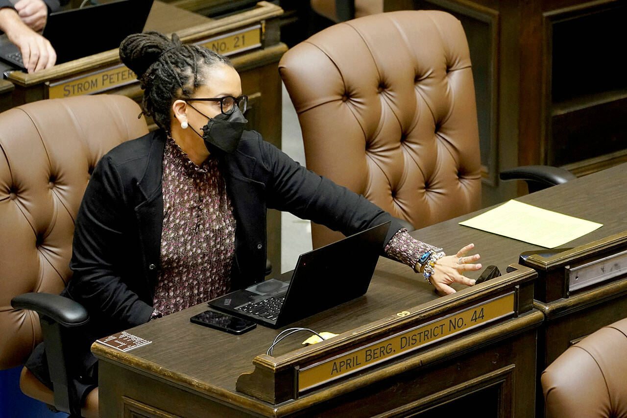 State Rep. April Berg, D-Mill Creek, pushes a button to cast a vote on the House floor Thursday at the Capitol in Olympia. (AP Photo/Ted S. Warren)