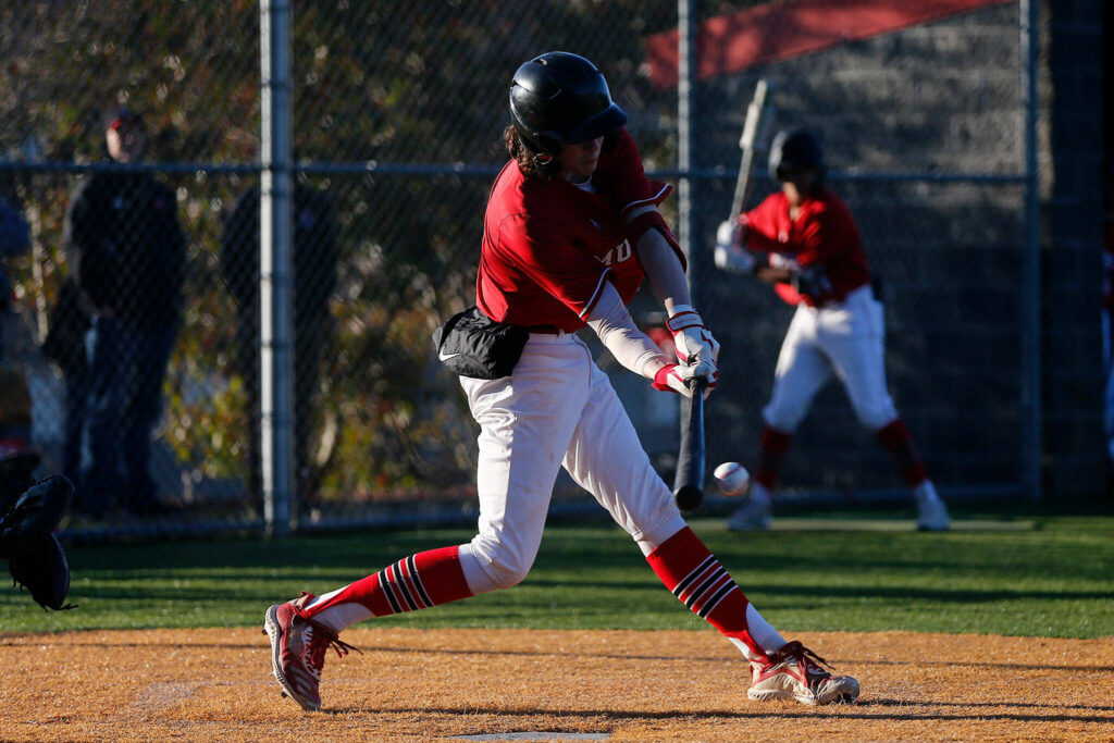 Archbishop Murphy’s Max Rodabaugh puts the ball in play to drive in a run during a jamboree game against Seattle Prep Wednesday, March 9, 2022, in Everett, Washington. (Ryan Berry / The Herald)
