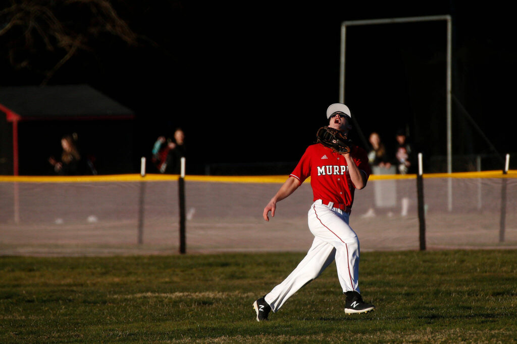 Archbishop Murphy’s Matt Overholt snags a fly ball before throwing out a runner trying to get back to first during a jamboree game against Seattle Prep Wednesday, March 9, 2022, in Everett, Washington. (Ryan Berry / The Herald)
