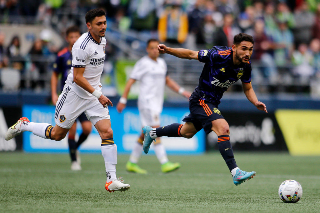 The Seattle Sounders’ Cristian Roldán passes the ball against the Los Angeles Galaxy Saturday, March 12, 2022, at Lumen Field in Seattle, Washington. (Ryan Berry / The Herald)
