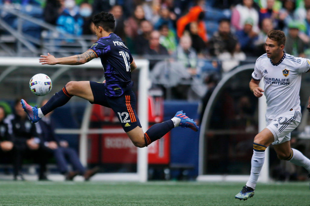 The Seattle Sounders’ Fredy Montero tries to collect. Pass and get pst the defense against the Los Angeles Galaxy Saturday, March 12, 2022, at Lumen Field in Seattle, Washington. (Ryan Berry / The Herald)
