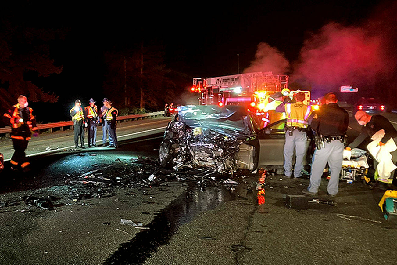 The scene of a two car collision southbound on I-5 in Everett, just south of 41st Street, early on Saturday, Feb. 19, 2022. (Washington State Patrol)
