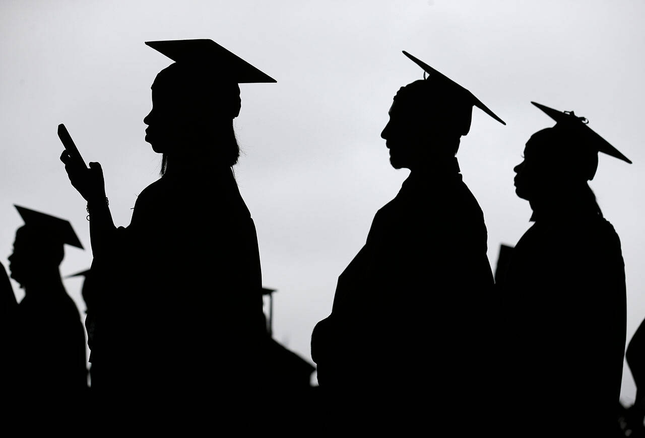 Graduates line up before the start of the Bergen Community College commencement at MetLife Stadium in East Rutherford, N.J., in May 2018. There’s no single policy or action that will alleviate America’s $1.61 trillion student loan debt crisis while simultaneously preventing students from taking on unaffordable amounts of future debt. Higher education financing experts are divided on the exact combination of solutions, but all agree it will require a multipronged approach. (Seth Wenig / Associated Press file photo)