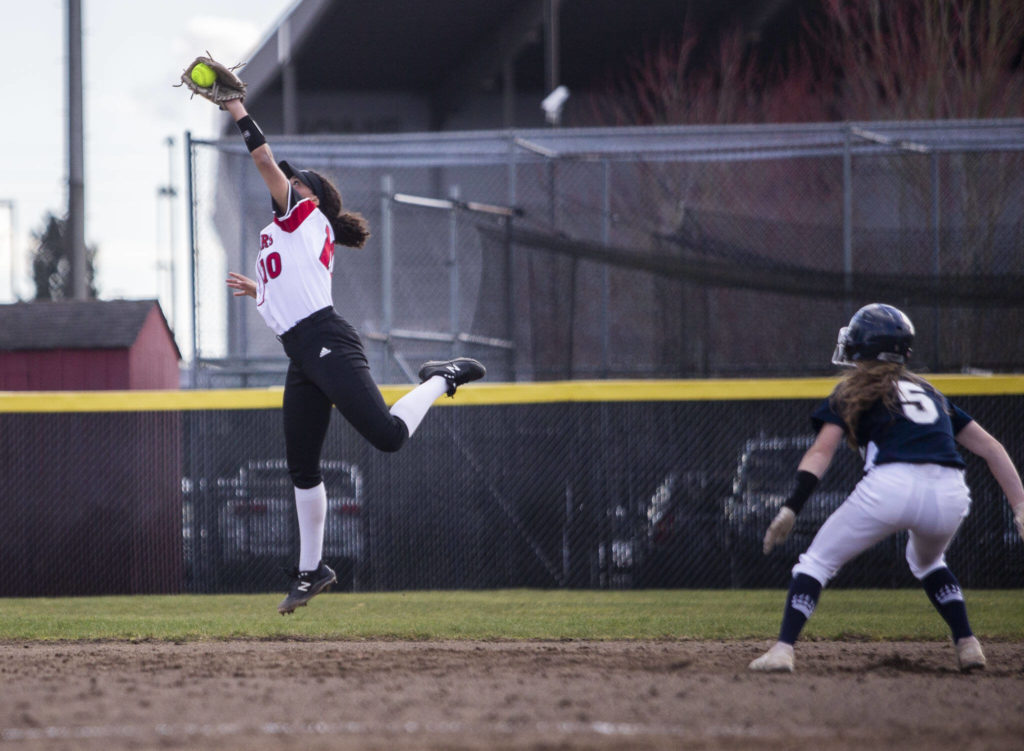Snohomish’s Emma Hansen makes a leaping catch during the game against Glacier Peak on Wednesday in Snohomish. (Olivia Vanni / The Herald)
