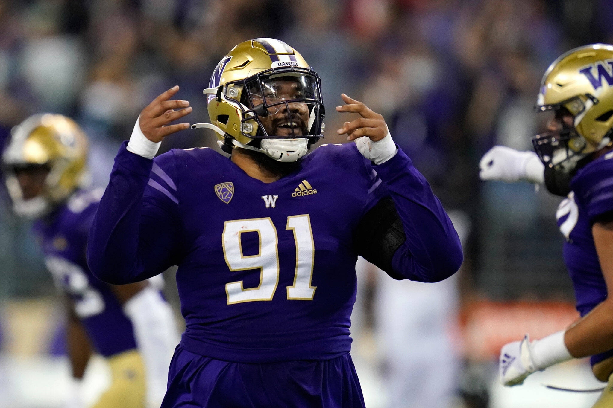 Washington’s Tuli Letuligasenoa reacts after a play against California on Sept. 25, 2021, in Seattle. (AP Photo/Elaine Thompson)