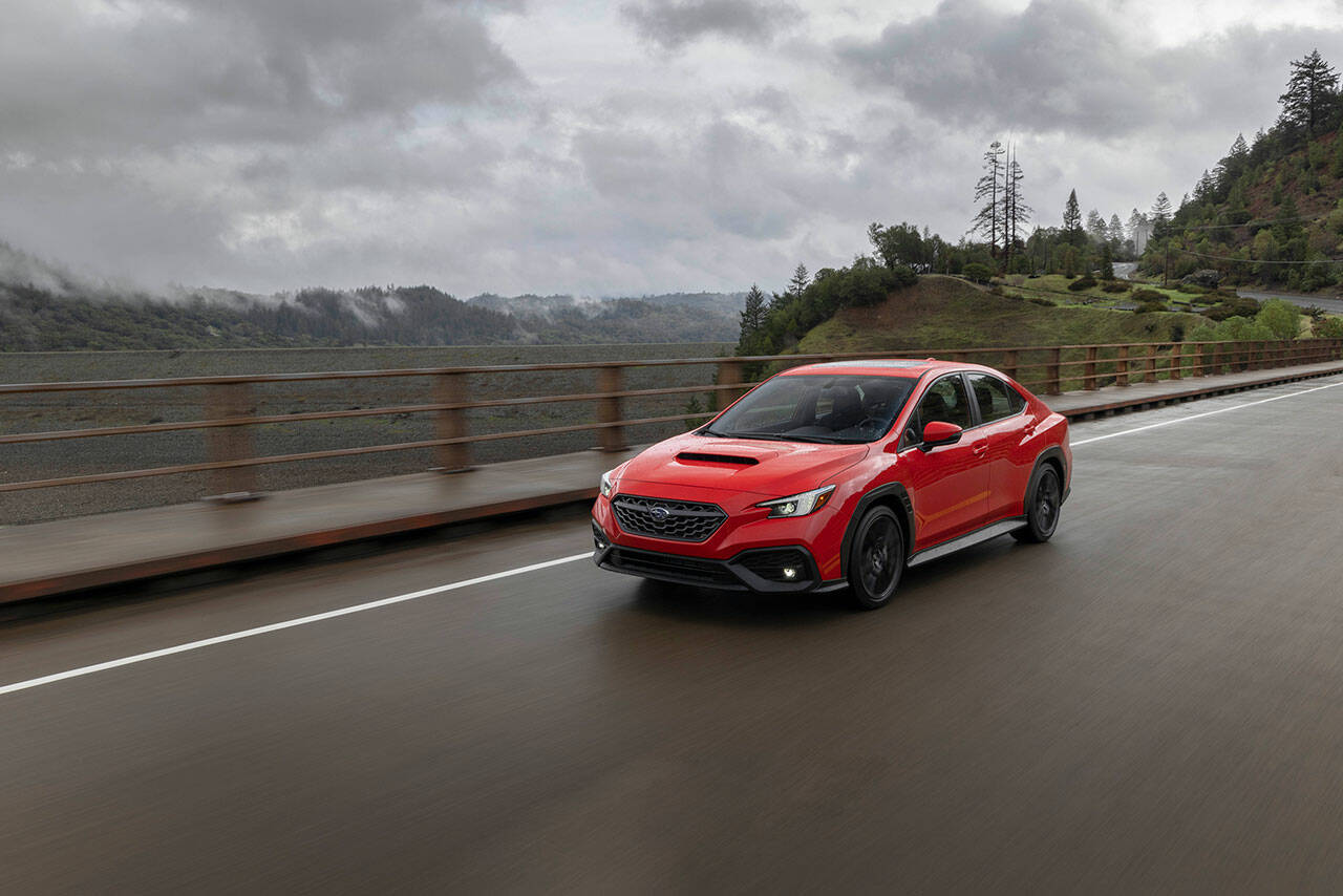 The 2022 Subaru WRX has a widened hexagonal grille, compact LED headlights, and a broad hood scoop. (Manufacturer photo)