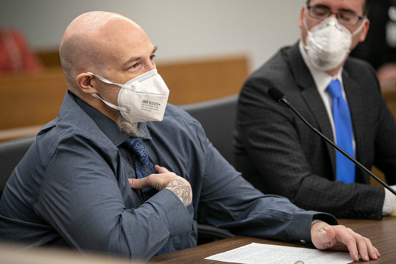 Eric Krueger, 46, who was convicted of his role in a 1997 double homicide in Marysville and originally sentenced to life in prison, speaks in court during his resentencing Tuesday, March 29, 2022, at the Snohomish County Courthouse in Everett, Washington. (Ryan Berry / The Herald)