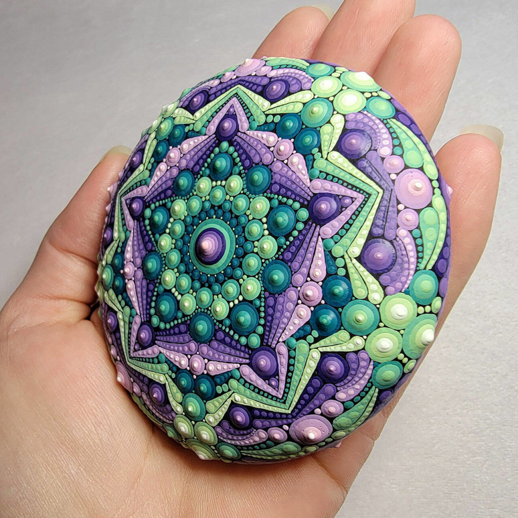 Boyce uses a technique called dotillism to create elaborate and colorful patterns on flat rocks. (Renee Boyce)
