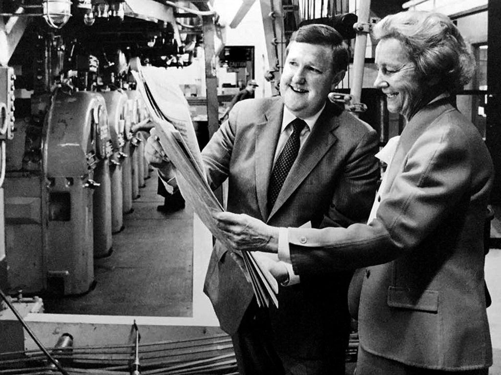 Katharine Graham, then CEO and chairwoman of the board of the Washington Post Co., looks over a copy of The Daily Herald with Larry Hanson, then Herald publisher, during her visit to Everett in 1984. The Post. Co. owned The Herald from 1978 until 2013.
