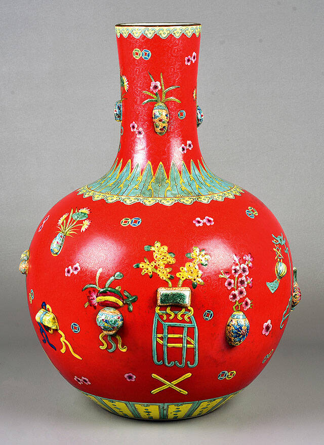 The red Chinese porcelain vase decorated with vases and flowers sold at a Bunch auction in 2021 for $354.