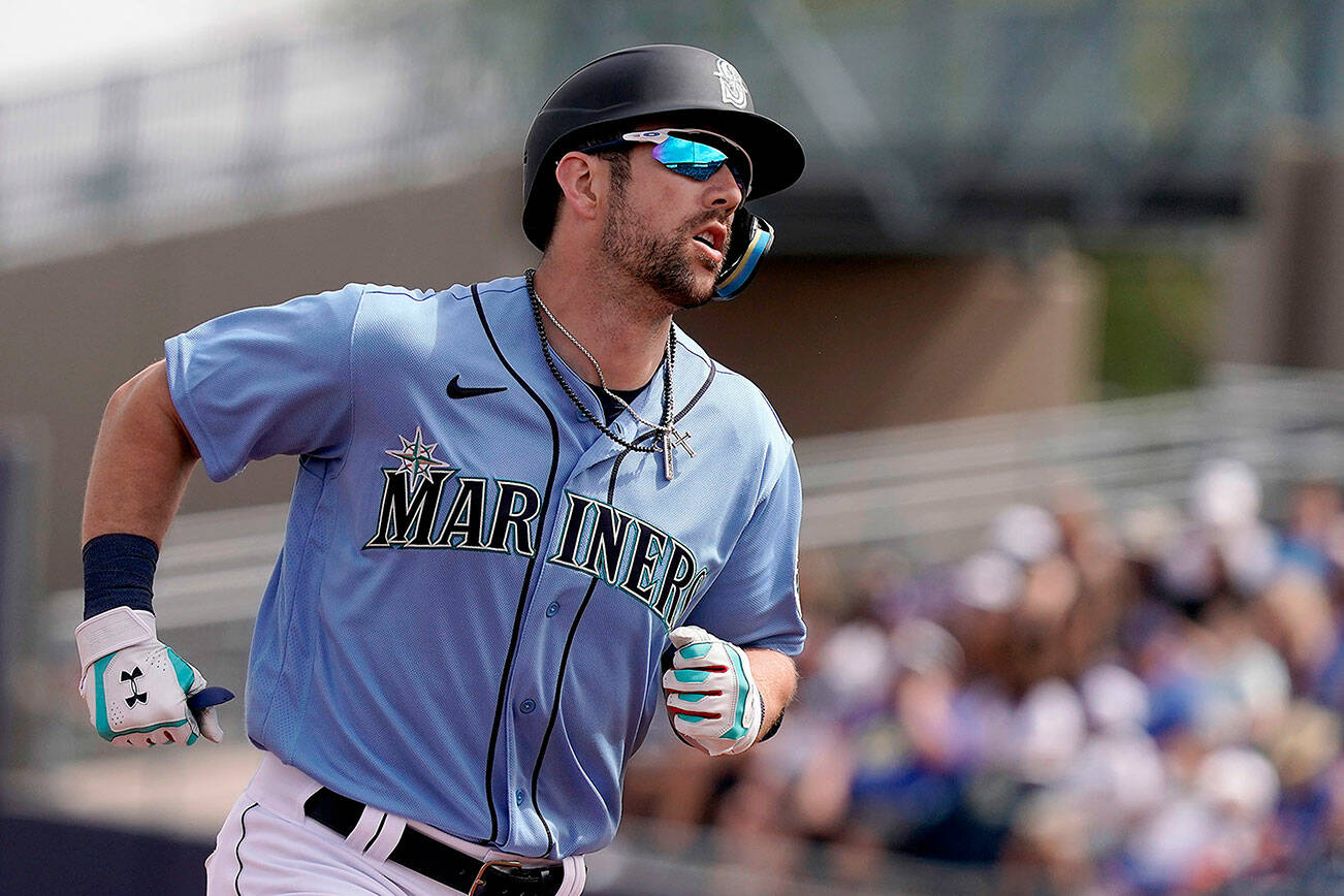 Seattle Mariners' Steven Souza Jr. rounds the bases after hitting a grand slam during the first inning of a spring training baseball game against the Los Angeles Dodgers Saturday, March 19, 2022, in Peoria, Ariz. (AP Photo/Charlie Riedel)