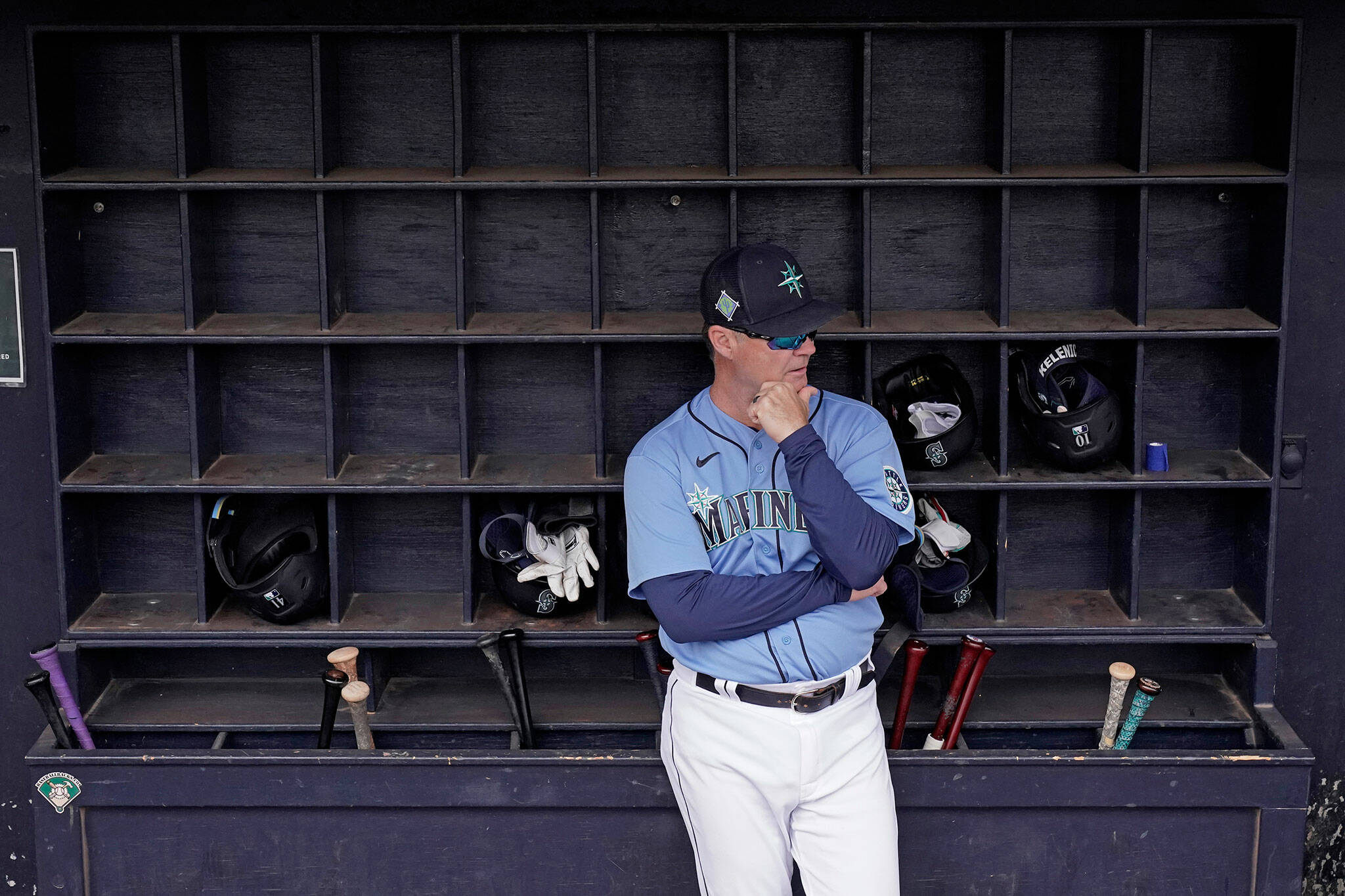 Mariners manager Scott Servais waits in the dugout before a spring training game against the Royals on March 29, 2022, in Peoria, Ariz. (AP Photo/Charlie Riedel)