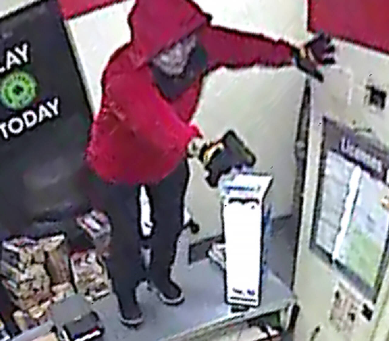 A suspect in the killing of Nagendiram Kandasamy was caught on a surveillance camera during the armed robbery of a 7-Eleven store in Edmonds on Feb. 21, 2020. (Edmonds Police Department)