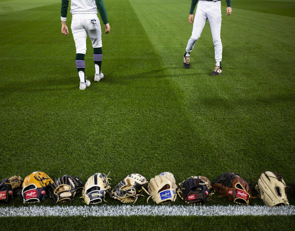 Edmonds-Woodway players warm up before the game against Kentwood at T-Mobile Park on Friday, April 8, 2022 in Seattle, Washington. (Olivia Vanni / The Herald)
