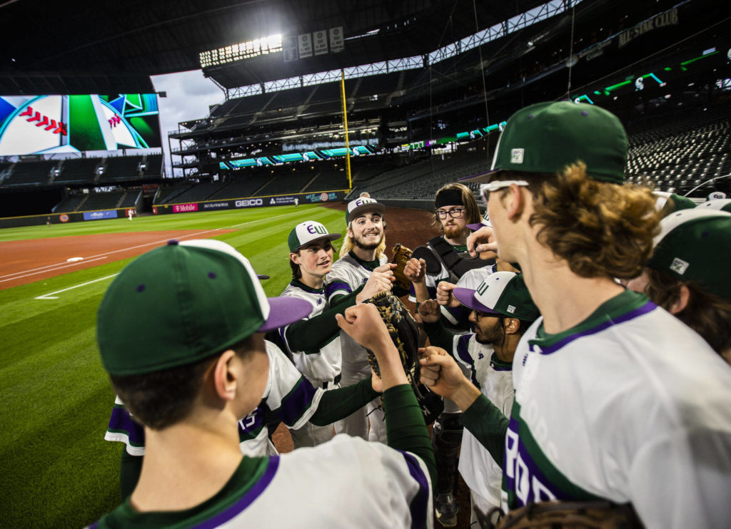 Edmonds-Woodway players cheer before heading out onto the field at T-Mobile Park on Friday, April 8, 2022 in Seattle, Washington. (Olivia Vanni / The Herald)
