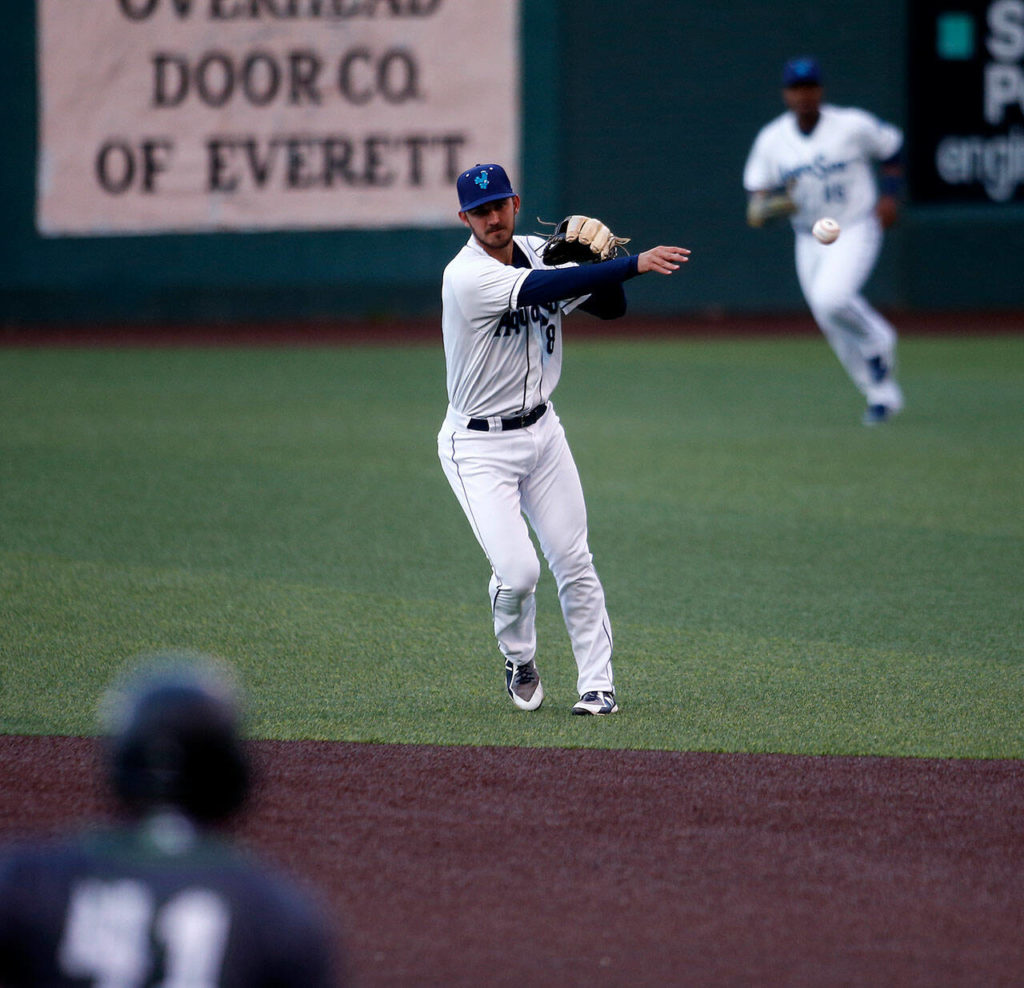 The AquaSox&rsquo;s James Parker throws out a runner after fielding a grounder during a game against Eugene Friday, April 8, 2022, at Funko Field in Everett, Washington. (Ryan Berry / The Herald)
