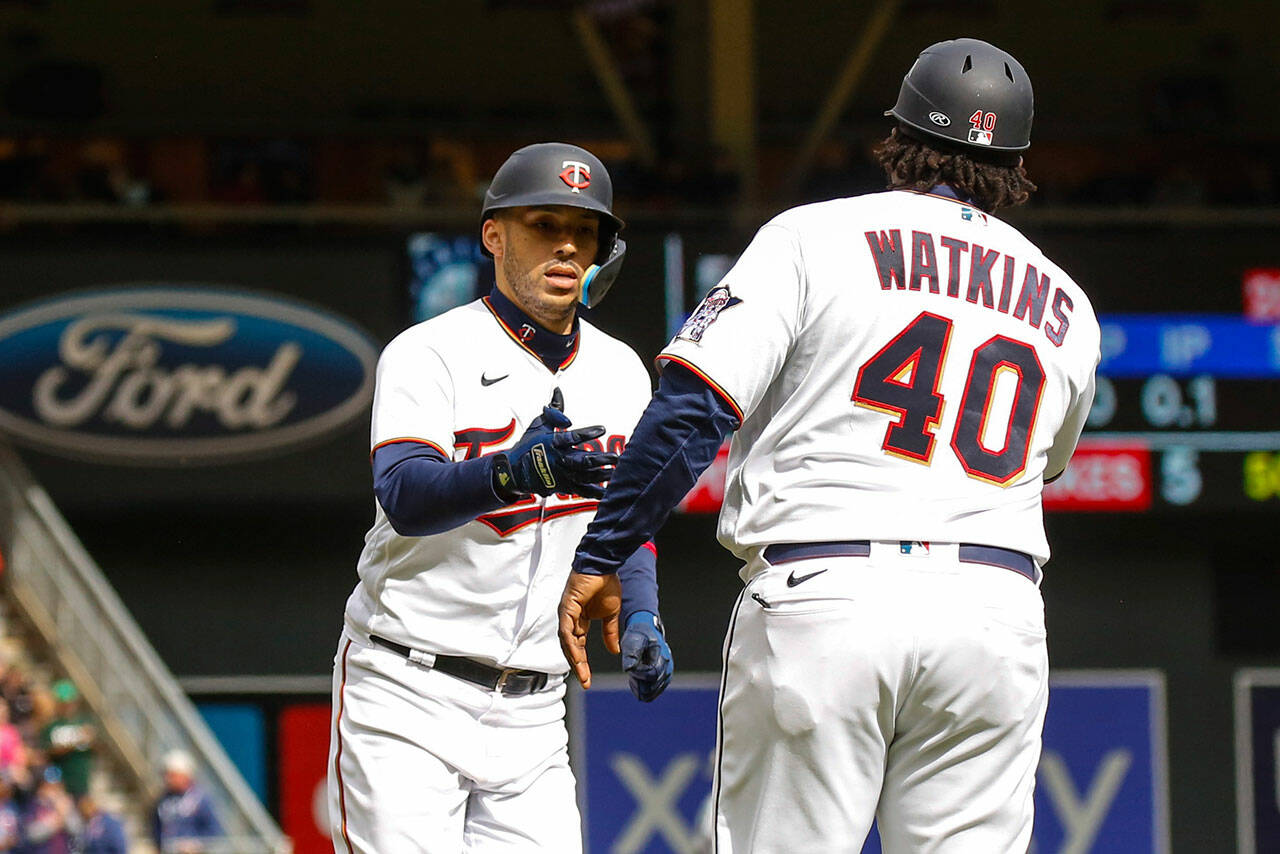 Minnesota Twins’ Carlos Correa rounds third base after hitting a solo home run against the Seattle Mariners during the sixth inning of a game Sunday in Minneapolis. (AP Photo/Nicole Neri)