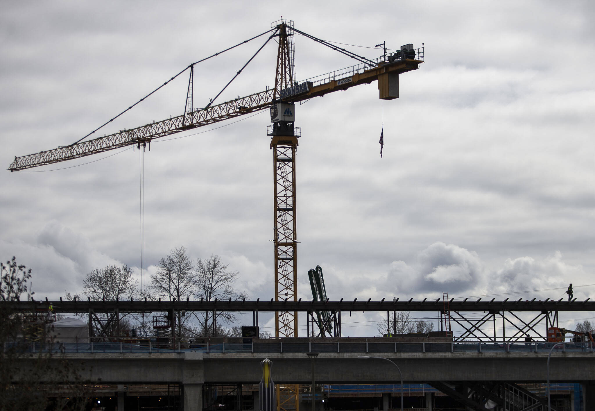 Construction crews work on the Lynnwood Light rail station March 29. (Olivia Vanni / Herald file)