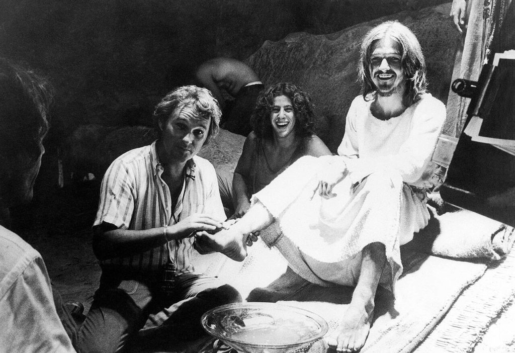 Producer-director Norman Jewison (left) demonstrates how he wants an actor to wash the feet of Jesus, portrayed by Ted Neeley, during filming of the movie version of the rock musical, “Jesus Christ Superstar” in Bethlehem, Israel, on Oct. 8, 1972. (Associated Press)
