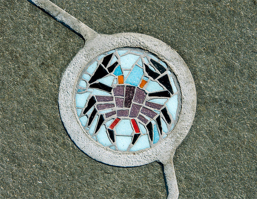 “Nā Kālai Ola” (“Life Voyagers”) by Stuart Nakamura (2017) at the Innovations Public Charter School in Kailua-Kona, Hawaii, created for the Hawaii State Foundation on Culture and the Arts. A half-dozen small glass mosaic inlays of aquatic animals create areas of self-discovery for children at the school and adds color accents to a concrete pad. (Photo courtesy Stuart Nakamura)
