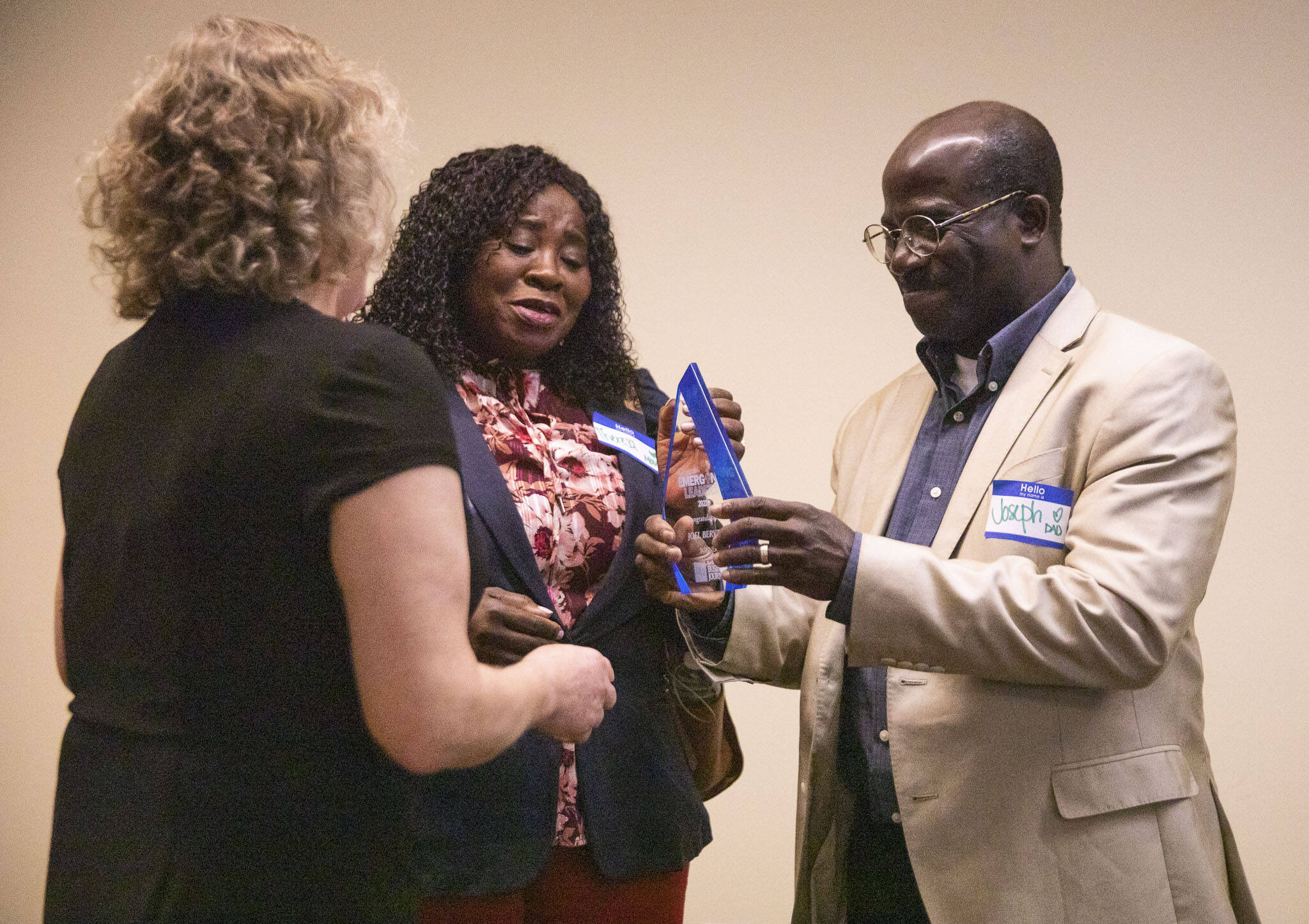 Theresa and Joesph Bervell, the parents of Emerging Leaders winner Joel Bervell, accept the award on his behalf at a ceremony on Wednesday in Everett. (Olivia Vanni / The Herald)