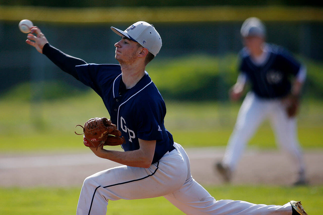 Glacier Peak’s Mason Divinney delivers a pitch against Kamiak Friday, April 15, 2022, at Kamiak High School in Mukilteo, Washington. (Ryan Berry / The Herald)