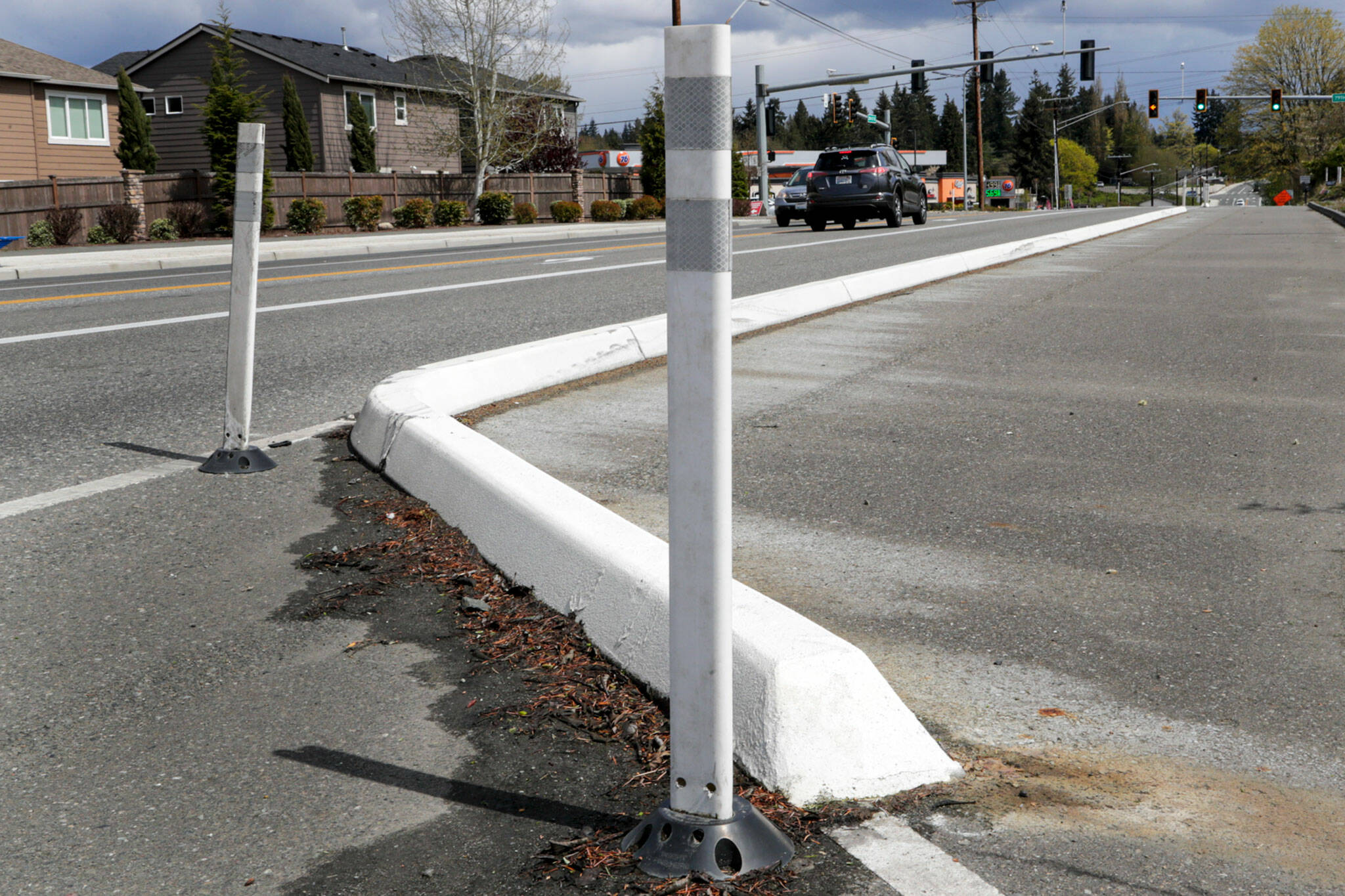The curb median keeps vehicles from the shoulder on the south side of 20th Street SE in Lake Stevens. (Kevin Clark / The Herald)