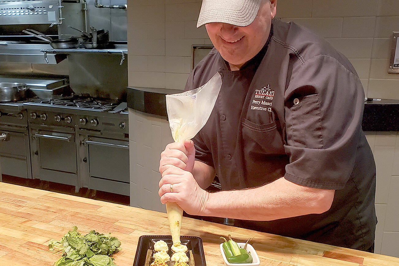 Tulalip Resort Casino executive chef Perry Mascitti pipes out some compound butter coins. (Tulalip Resort Casino)