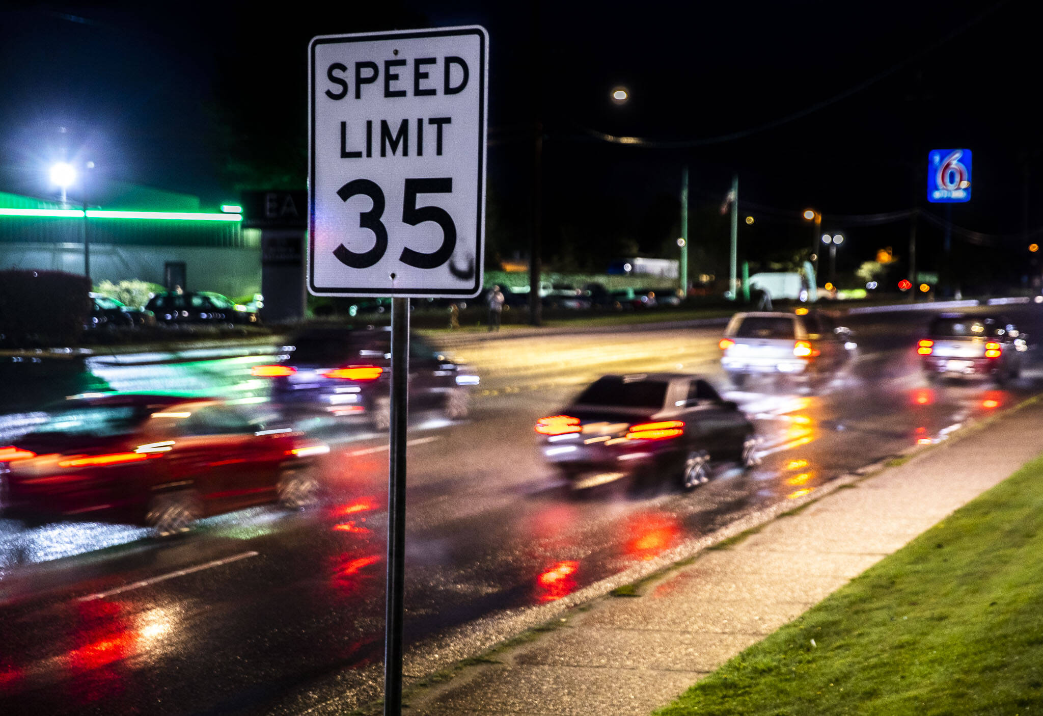 Drivers head north on Evergreen Way through the Everett Mall Way intersection in Everett. The city is seeking to lower the speed limits along Evergreen Way and Everett Mall Way. (Olivia Vanni / The Herald)